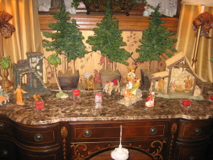 This nativity scene grows with the addition each year of a piece or two, and now it occupies the entire surface of our dining room sideboard.