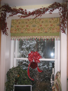 The decorating for Christmas is already under way, and here is a kitchen window, looking out on the garden with a dusting of snow on it.