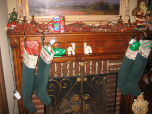 The stockings have been hung with care on the living room mantel.